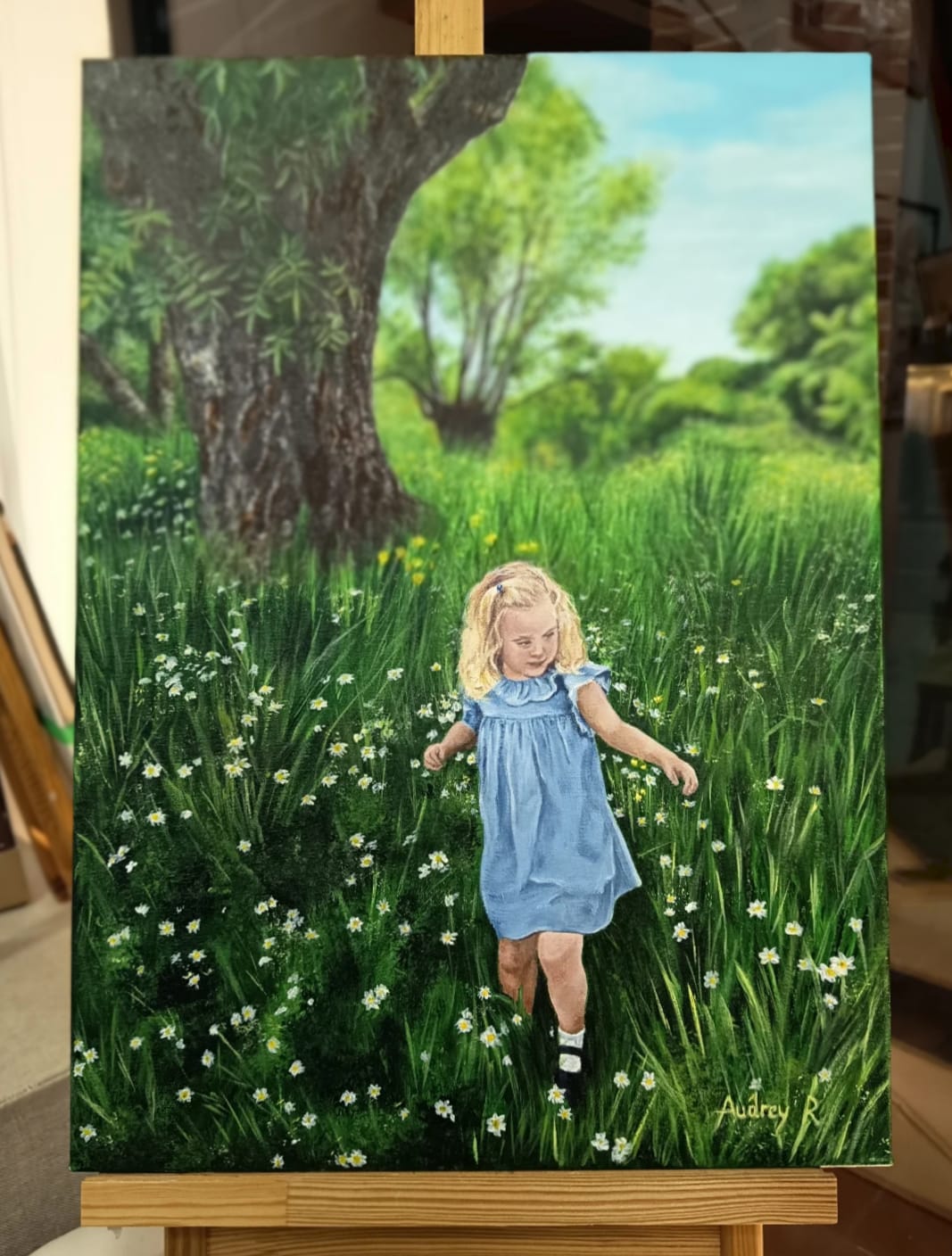Pintura al óleo de niña en campo de margaritas